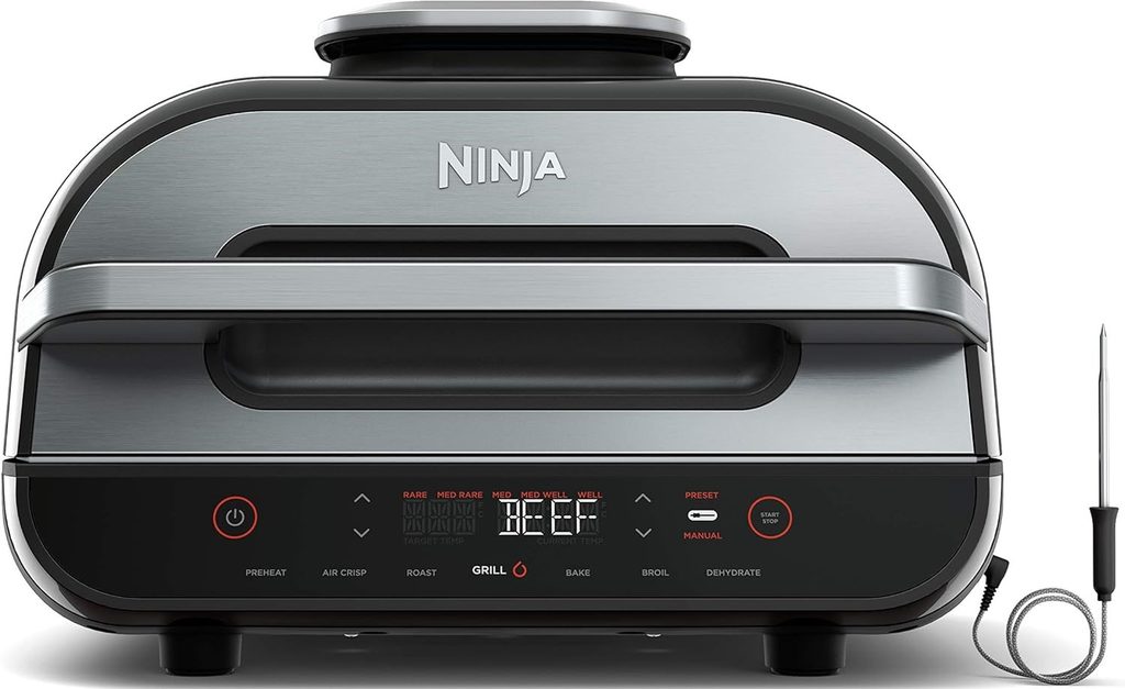 The Best Electric Grill — Ninja FG551 Electric Grill featuring an indoor countertop design with a grill grate for preparing meat, vegetables, and everyday meals.